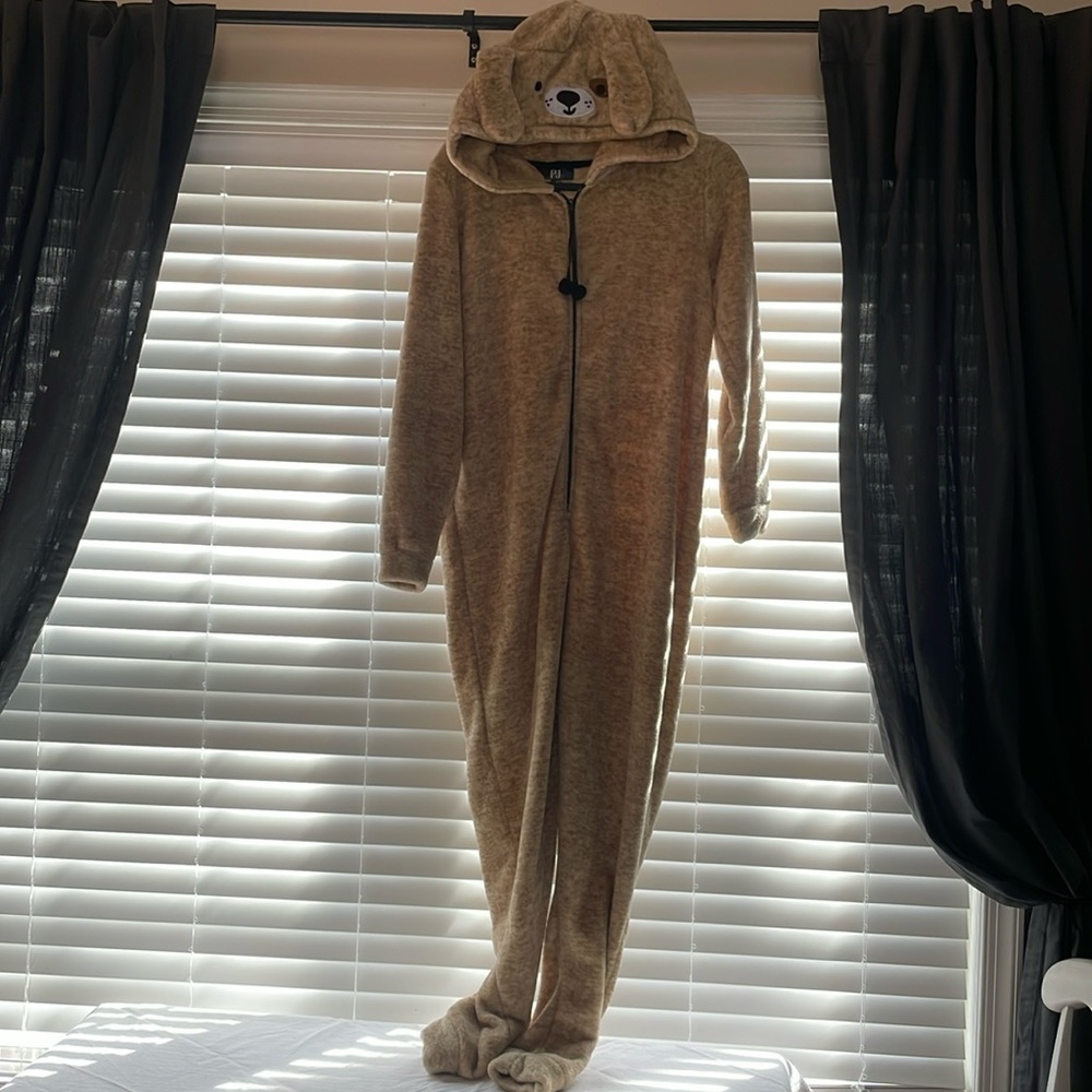 This cute dog onesie pajama is super soft and comfy. This is a size Medium.